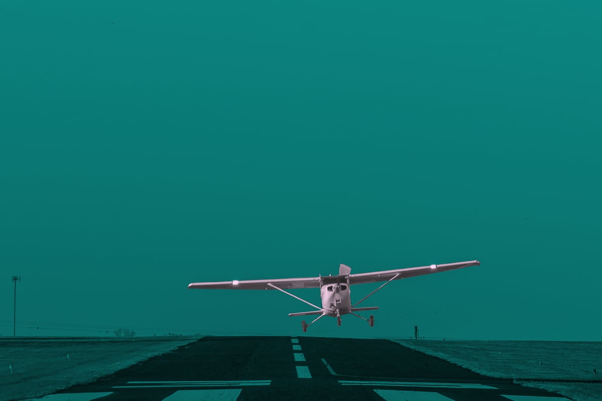 High-wing airplane landing in a crosswind