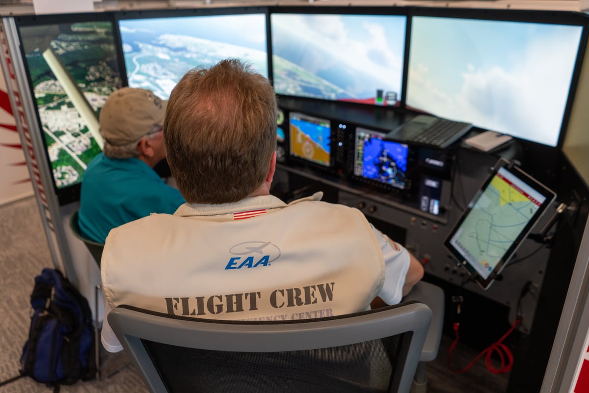 CFI and pilot training on a Redbird LD at AirVenture